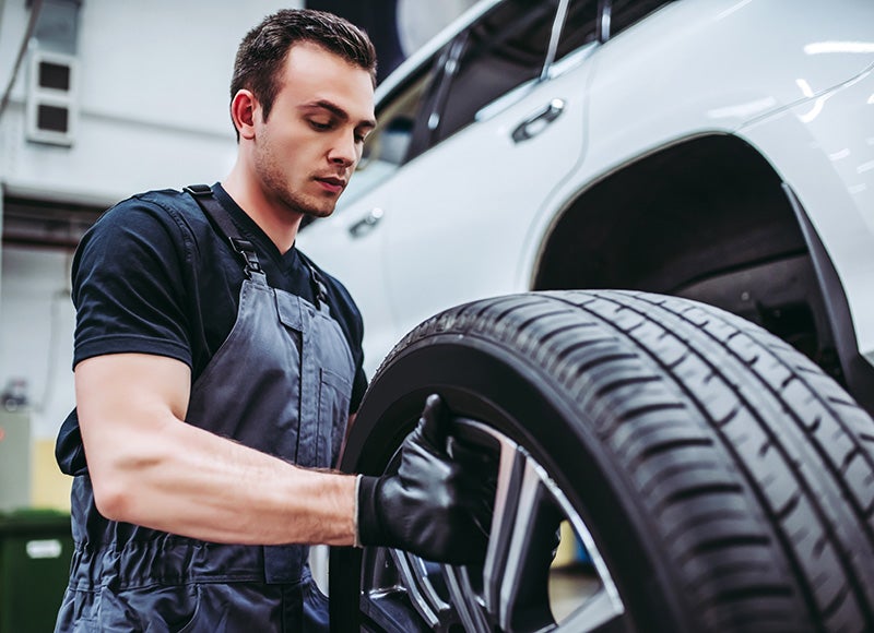 Service tech repairing a tire